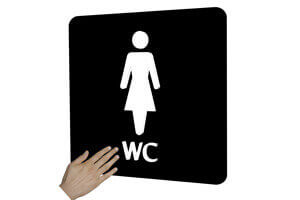 Illustration af et taktilt dametoilet-skilt.